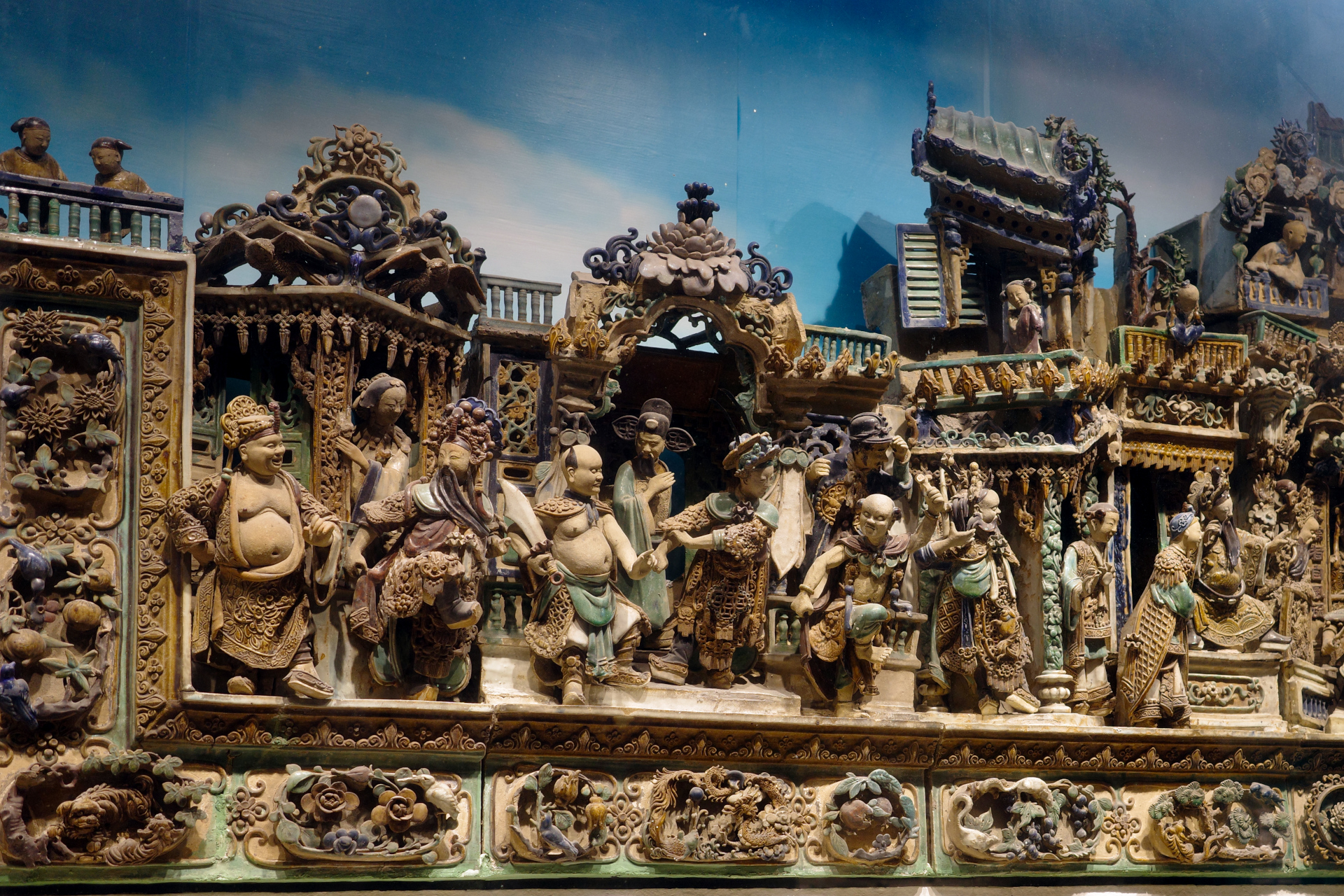 A wall of intricately carved figurines
